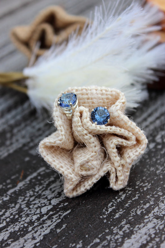 Concave Cut Quartz Stud Earrings in a Basket Setting